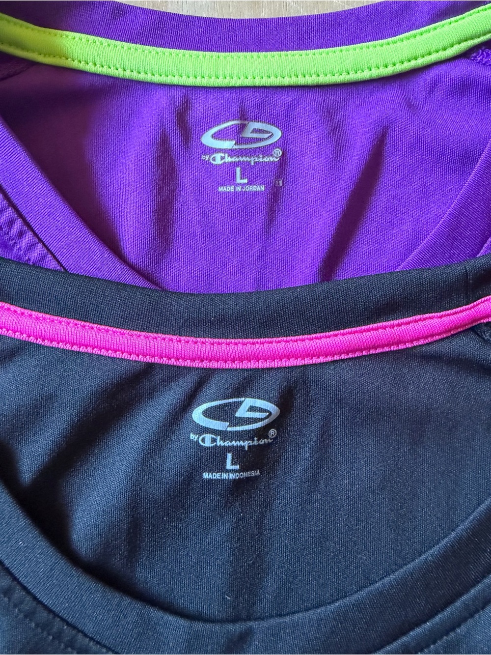 Two Champion Women’s Tops in Black w/Pink and Purple w/Lime Trim Size Large